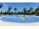 Interactive water play area with colorful features and palm trees at 12420 Destin Loop, Venice, FL 34293