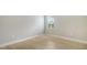 Well-lit bedroom with wood-look floors and a window at 12420 Destin Loop, Venice, FL 34293