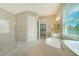 Spa-like bathroom featuring a large shower and soaking tub at 12420 Destin Loop, Venice, FL 34293