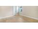 Bright bedroom featuring wood-look floors and a window at 12420 Destin Loop, Venice, FL 34293
