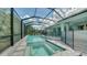 Resort-style pool and spa with screened enclosure at 12420 Destin Loop, Venice, FL 34293