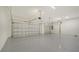 Spacious two-car garage with epoxy flooring and automatic openers at 12420 Destin Loop, Venice, FL 34293