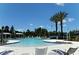Community pool with a waterslide and plenty of lounge chairs at 12420 Destin Loop, Venice, FL 34293