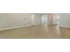 Open living area with light hardwood flooring and neutral tones at 12420 Destin Loop, Venice, FL 34293