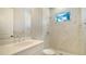 Clean bathroom with a shower, toilet and quartz vanity at 12420 Destin Loop, Venice, FL 34293