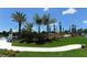 Landscaped area with a winding path, lush greenery, and a water feature at 12420 Destin Loop, Venice, FL 34293