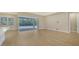 Gathering room with sliding doors opening to the pool at 12420 Destin Loop, Venice, FL 34293