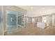 Open kitchen with island, stainless steel appliances, and white cabinetry at 12420 Destin Loop, Venice, FL 34293