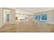 Open concept kitchen with white cabinets and island at 12420 Destin Loop, Venice, FL 34293