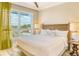 Bright bedroom with king-size bed and large windows offering an outdoor view at 915 Seaside Dr # 410 Weeks 14-15, Sarasota, FL 34242