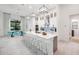 Modern kitchen with white cabinets, quartz countertops, and stainless steel appliances at 14219 Wenzel Ave, Port Charlotte, FL 33981