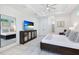 Main bedroom with king bed, large TV, and walk-in closet at 14219 Wenzel Ave, Port Charlotte, FL 33981