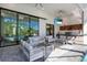 Comfortable patio furniture near the pool and outdoor kitchen at 14219 Wenzel Ave, Port Charlotte, FL 33981
