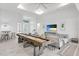 Spacious game room with shuffleboard and seating area at 14219 Wenzel Ave, Port Charlotte, FL 33981