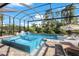 Covered lanai with a view of the refreshing pool and spa at 14219 Wenzel Ave, Port Charlotte, FL 33981