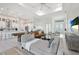 Open floor plan with a large sectional and a shuffleboard table at 14219 Wenzel Ave, Port Charlotte, FL 33981