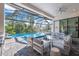 Relaxing pool and patio area with comfortable seating at 14219 Wenzel Ave, Port Charlotte, FL 33981