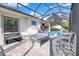 Covered patio with ping pong table and pool; great for recreation and fun at 14219 Wenzel Ave, Port Charlotte, FL 33981