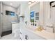 Clean bathroom with white cabinets, quartz countertop and a walk-in shower at 14219 Wenzel Ave, Port Charlotte, FL 33981
