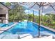 Inviting swimming pool with a covered patio and lounge chairs at 14219 Wenzel Ave, Port Charlotte, FL 33981