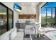 Covered outdoor kitchen with modern appliances and seating at 14219 Wenzel Ave, Port Charlotte, FL 33981