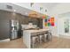 Open concept kitchen with island and stainless steel appliances at 8175 Dittmar St, Port Charlotte, FL 33981