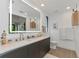 Elegant bathroom with double vanity and a large mirror at 8175 Dittmar St, Port Charlotte, FL 33981