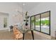 Bright dining room with glass doors leading to patio at 8175 Dittmar St, Port Charlotte, FL 33981