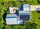 Home with solar panels, pool, and lush landscaping at 8175 Dittmar St, Port Charlotte, FL 33981