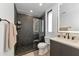 Modern bathroom with a large shower, double vanity, and updated fixtures at 8175 Dittmar St, Port Charlotte, FL 33981