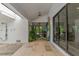 Covered outdoor walkway with access to indoor living areas and outdoor shower at 8175 Dittmar St, Port Charlotte, FL 33981