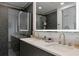 Modern bathroom with double vanity and a large mirror at 8175 Dittmar St, Port Charlotte, FL 33981
