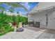 Outdoor kitchen, fire pit, and shower create the perfect entertaining space at 8175 Dittmar St, Port Charlotte, FL 33981