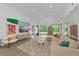 Open-plan living area with a comfortable sectional sofa at 8175 Dittmar St, Port Charlotte, FL 33981