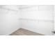 Bright walk-in closet featuring wire shelving and laminate flooring at 4612 Mondrian Ct, Sarasota, FL 34240
