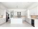 Modern kitchen with white cabinets, large island, and stainless steel appliances at 4612 Mondrian Ct, Sarasota, FL 34240