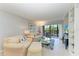 Spacious living area featuring a neutral color palette and access to a balcony at 512 W Venice Ave # 403, Venice, FL 34285