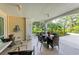 Covered patio with seating area and lush landscaping at 512 W Venice Ave # 403, Venice, FL 34285