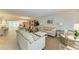 Bright and airy living room with comfortable seating and a dining area at 512 W Venice Ave # 403, Venice, FL 34285