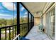 Screened lanai with outdoor furniture and pool view at 512 W Venice Ave # 403, Venice, FL 34285