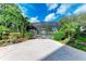 Inviting screened-in pool area with lush landscaping at 512 W Venice Ave # 403, Venice, FL 34285