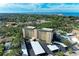 Aerial view of a building near the ocean with a parking area below at 512 W Venice Ave # 403, Venice, FL 34285