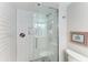 Shower with subway tile and glass enclosure at 512 W Venice Ave # 403, Venice, FL 34285