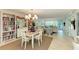 Charming dining area with a table and chairs, near a bookcase at 512 W Venice Ave # 403, Venice, FL 34285
