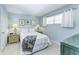 Light and airy bedroom with a queen bed and nightstands at 512 W Venice Ave # 403, Venice, FL 34285