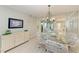 Dining area with view into living room at 512 W Venice Ave # 403, Venice, FL 34285