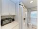 White kitchen featuring updated appliances and ample counter space at 512 W Venice Ave # 403, Venice, FL 34285
