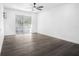 Bedroom with grey vinyl flooring and sliding glass doors leading to balcony at 1522 Pleasant Rd # G23, Bradenton, FL 34207