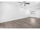 Bright living room with gray vinyl plank flooring and ceiling fan at 1522 Pleasant Rd # G23, Bradenton, FL 34207