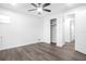 Bedroom with gray vinyl plank flooring and a view of the bathroom at 1522 Pleasant Rd # G23, Bradenton, FL 34207